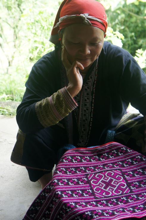 A Red Dzao woman from Ta Phin village and her homemade embroidery.
